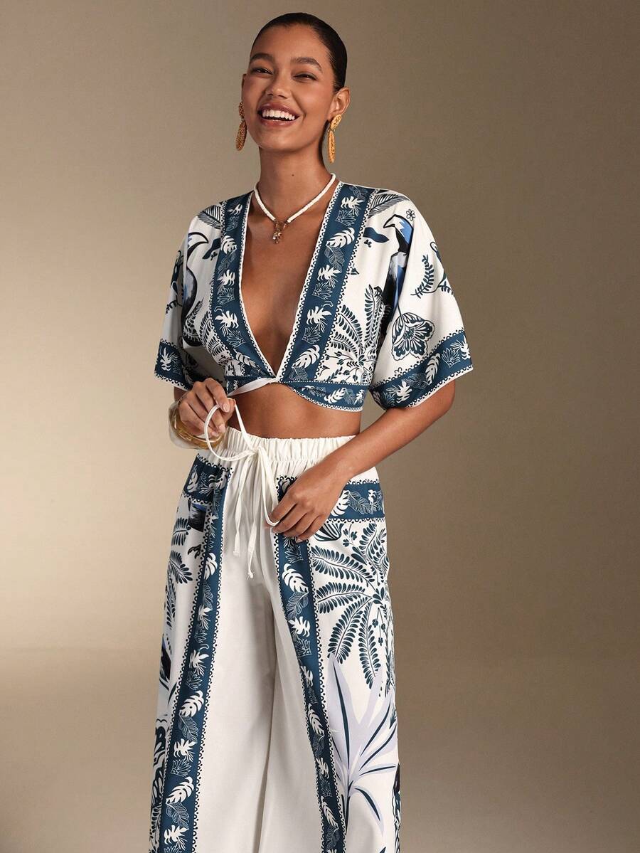 Embrace effortless elegance with our Boho Chic Swim Oasis 2-Piece Set. This stunning collection pairs a flowing kimono top with comfortable matching pants, creating the perfect vacation ensemble. The lightweight, breathable fabric keeps you cool and stylish whether you're lounging by the pool, strolling the beach, or enjoying sunset dinners. The relaxed silhouette flatters all body types while the bohemian design adds an artistic touch to your summer wardrobe.