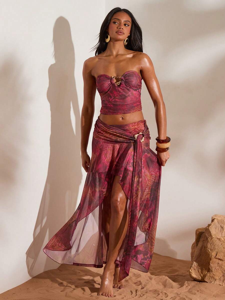 Front full view of burgundy abstract print ruched bandeau top and high-slit mesh maxi skirt two-piece set for beach vacation styling