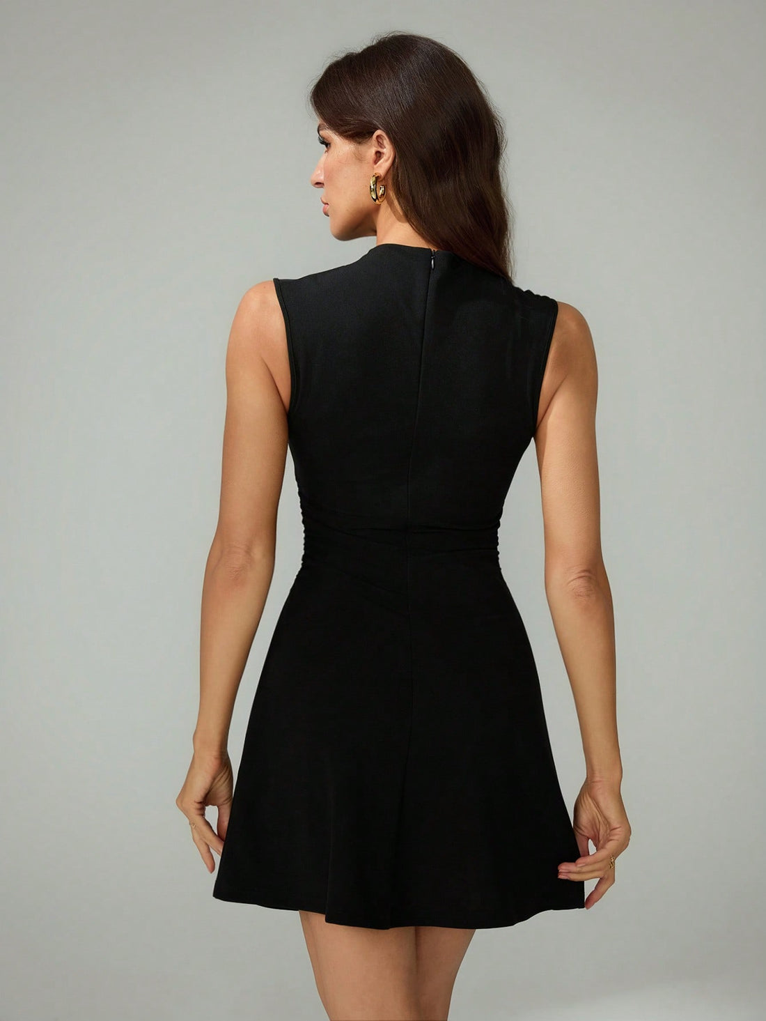 This sophisticated black mini dress features elegant pleated detailing and a flattering A-line silhouette designed specifically for tall frames. The refined construction ensures proper proportions and length, while the timeless black hue pairs effortlessly with any accessory. Ideal for weddings, cocktail parties, and festival occasions, this dress delivers polished elegance with understated luxury. The pleated design adds visual interest and movement, making it a versatile choice for elevated events where y