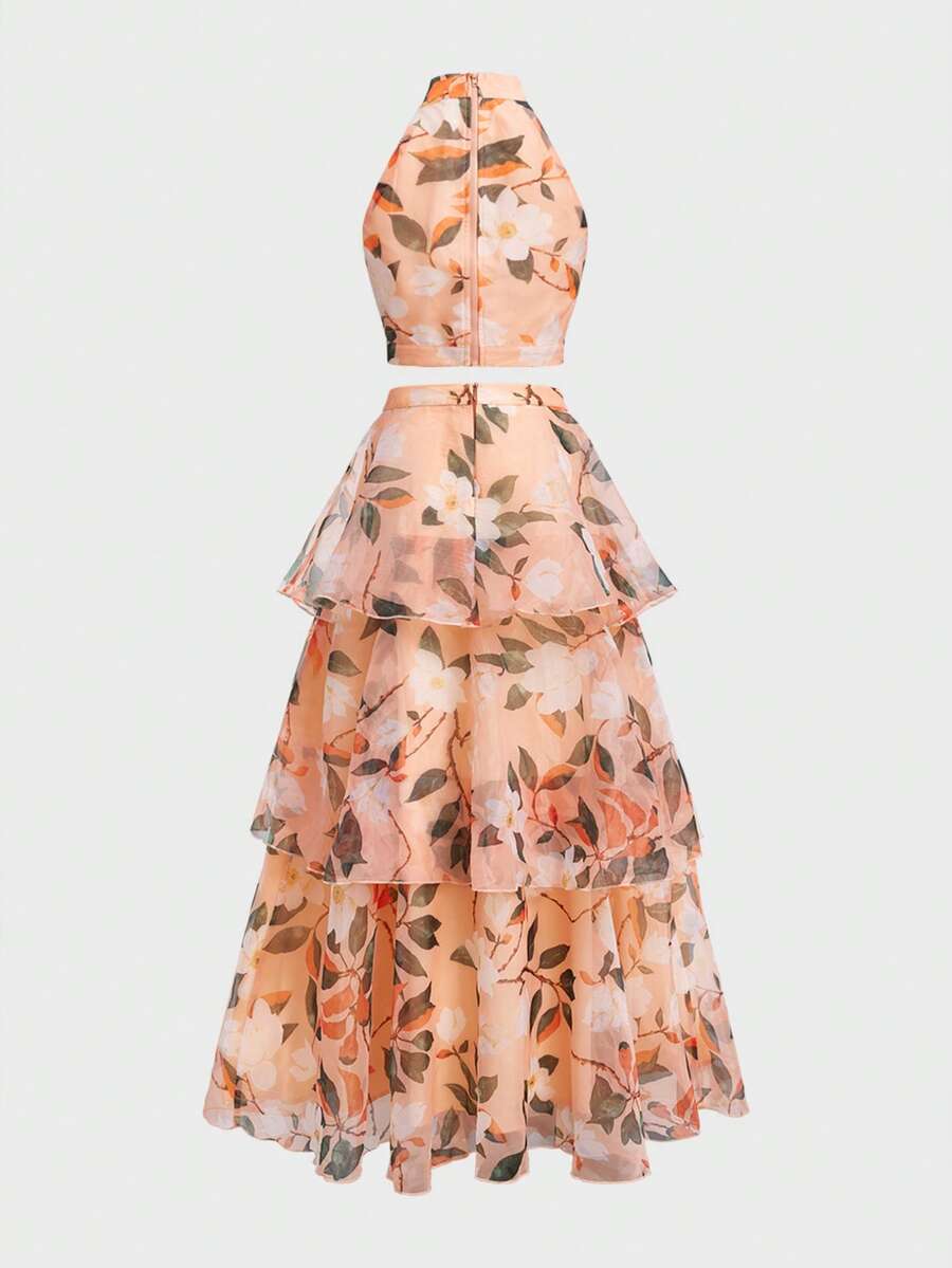 Back view of ivory botanical crop top and flowing layered maxi skirt