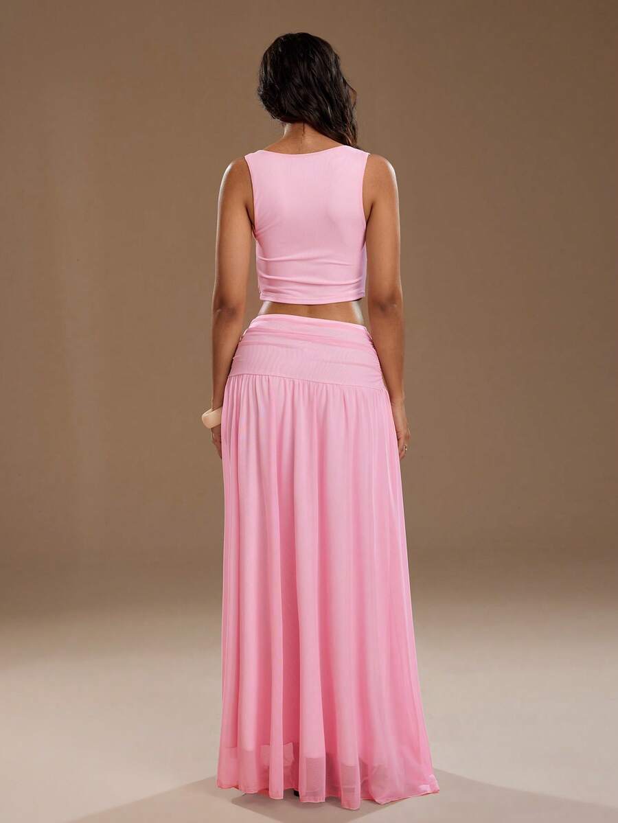 Exude Ethereal Sophistication in Our Elegant Spring-Summer 2-Piece Set!

Experience the breathtaking fusion of romantic heritage and sharp, modern architectural tailoring. This stunning camisole and mesh skirt ensemble is meticulously designed for the woman who values a high-fashion, "quiet luxury" approach to seasonal dressing—the ultimate centerpiece for prestigious garden weddings, exclusive rooftop soirées, and high-authority summer social gatherings.

Iconic Camisole Artistry: Featuring a masterfully c