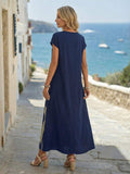 Back view of navy loose maxi dress with long relaxed column shape