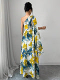 Detail view of zipper and fitted waist on women's maxi dress
