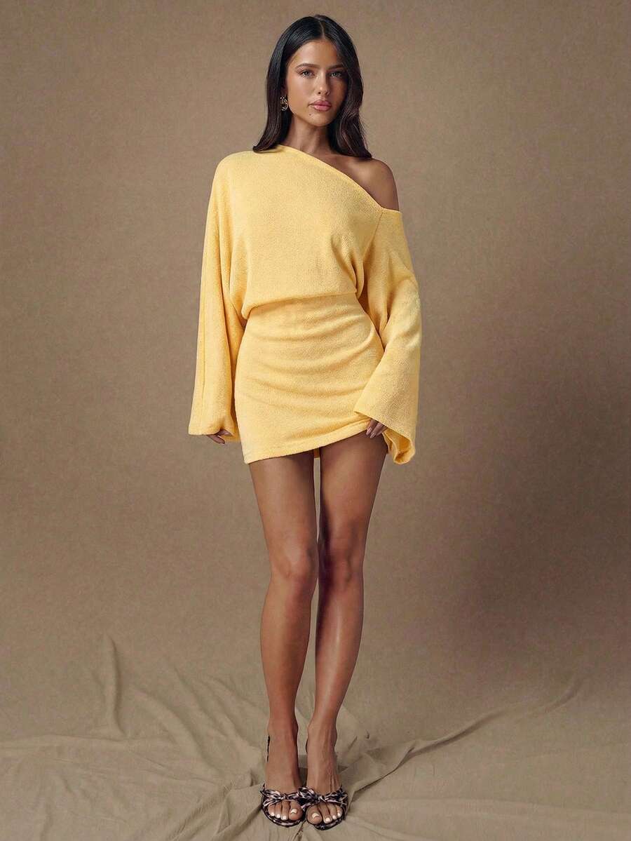 Yellow long sleeve mini dress styled with heels