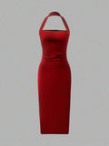 Back view red halter midi dress with center seam