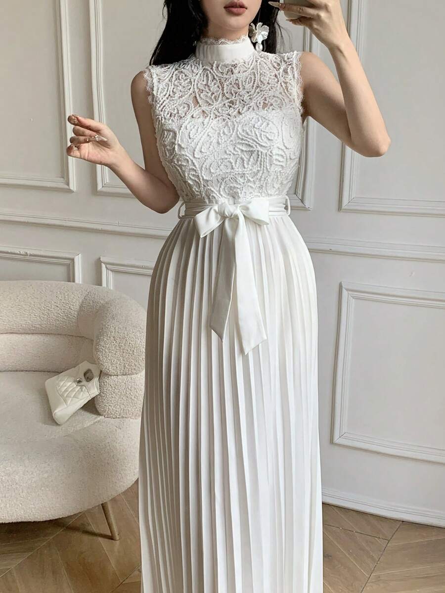 Close detail view of lace bodice pleated maxi dress showing visible color, print, and silhouette