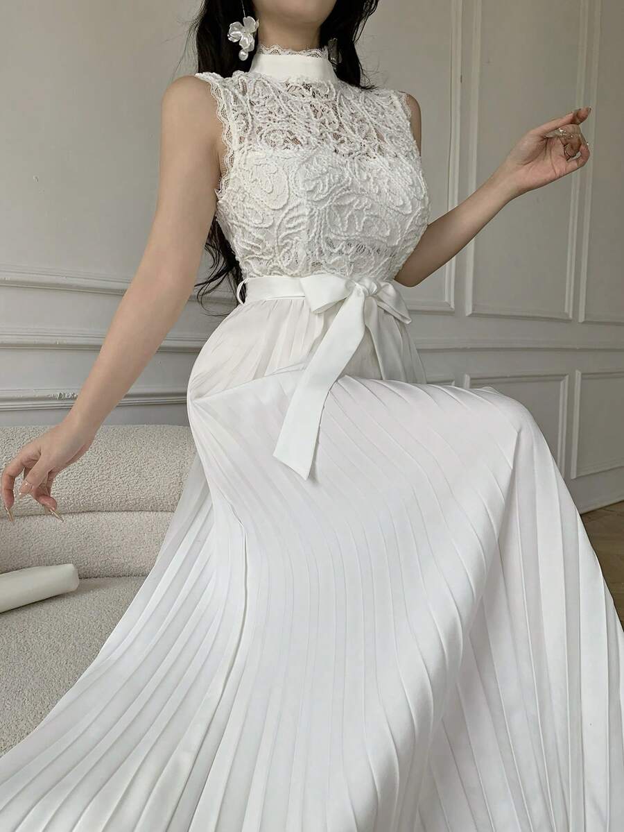 Back view of lace bodice pleated maxi dress showing visible color, print, and silhouette