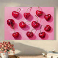 Room view of red cherry wall art above console with flowers and books