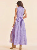 Back view of mauve floral maxi dress with self-tie waist and flared skirt