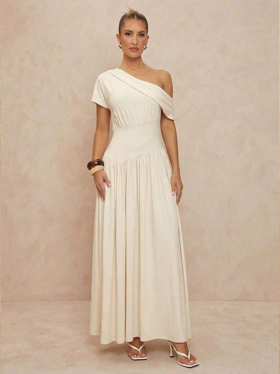 Elevate your formal wardrobe with this stunning one-shoulder cream maxi dress. Featuring an elegant draped bodice with asymmetrical neckline and graceful ruching, the dress flows into a flattering A-line silhouette with a high waistline. Crafted from a soft knitted fabric blend of 95% polyester and 5% elastane, it offers medium stretch for comfortable movement. The short batwing sleeves and flared hem add sophisticated dimension. Perfect for weddings, evening events, and special occasions. Hand wash or prof