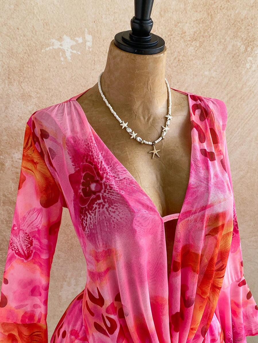 Elevate your festival wardrobe with this stunning floral mini dress. Featuring a flattering deep V-neckline, asymmetrical ruffle hem, and tiered layers, this piece combines bohemian charm with modern edge. The flare sleeves and A-line silhouette create a graceful, feminine look perfect for beach days and music festivals alike. Crafted from breathable mesh fabric with a comfortable medium stretch, the semi-sheer design pairs beautifully with your favorite slip or camisole. The pink floral print adds vibrant 