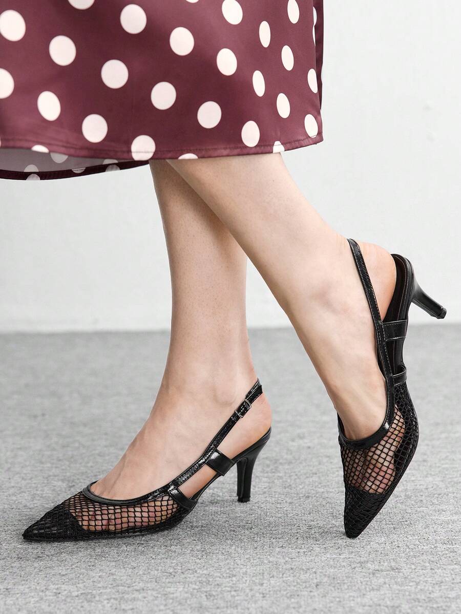 Elevate your evening wardrobe with these striking black stiletto heels, designed for the modern woman who commands attention. The pointed toe silhouette creates a sleek, elongating line, while the hollow-out detailing adds contemporary sophistication and visual interest. Slip-on construction ensures effortless styling without sacrificing the polished look of a classic pump. The stiletto heel provides that coveted lift and confidence boost for special occasions, dinners, or nights out. Crafted for those who 