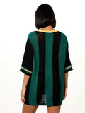 Side angle of oversized multicolor tunic top with number print