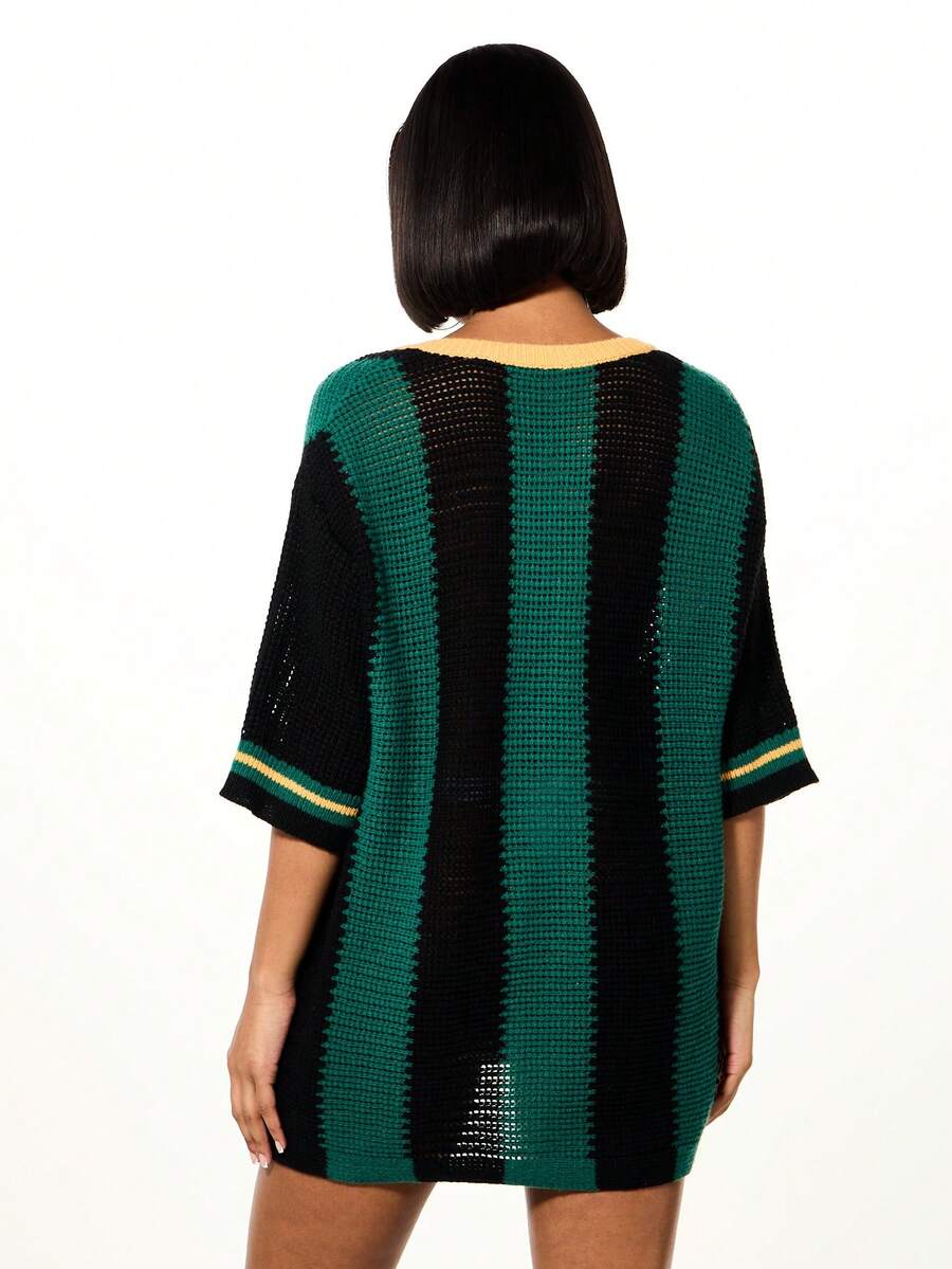 Side angle of oversized multicolor tunic top with number print