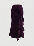 Close-up of purple velvet asymmetric skirt with cascading ruffle panel