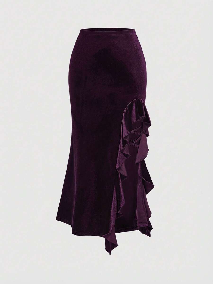 Close-up of purple velvet asymmetric skirt with cascading ruffle panel