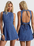 Front and back view of medium-wash backless denim mini dress with tie waist and zipper