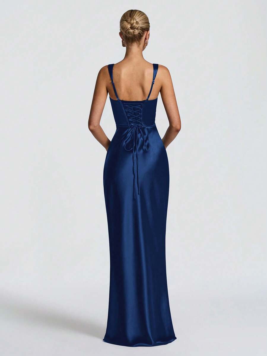 Rear full-length view of navy satin gown with lace-up back and adjustable shoulder straps