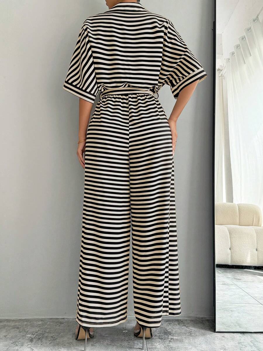 Front view of striped belted wide-leg jumpsuit showing visible color, print, and silhouette