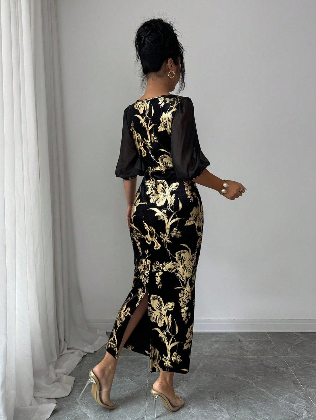 Crafted from luxurious velvet with a sophisticated foil print, this dress embodies timeless elegance and romantic charm. The flowing silhouette flatters the feminine form while the rich fabric drapes beautifully, making it an ideal choice for vacations, special occasions, or elevated everyday wear. The intricate foil detailing catches light gracefully, adding dimension and visual interest. Versatile enough to transition from day to evening, this piece pairs effortlessly with accessories for a polished, refi