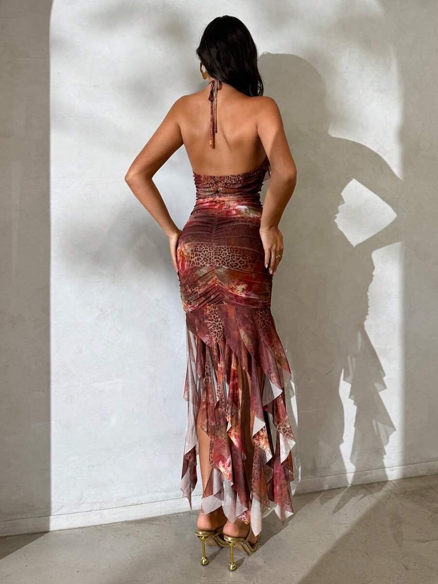 Elevate your warm-weather wardrobe with this stunning leopard floral tie-neck beach dress. Featuring an asymmetrical hemline, backless design, and flattering ruched details, this mini dress combines elegance with effortless style. The halter neckline and slim fit create a sophisticated silhouette perfect for summer getaways, honeymoons, and special occasions. Crafted from a breathable mesh blend with high stretch fabric, it moves with you all day long. Machine washable for easy care.
