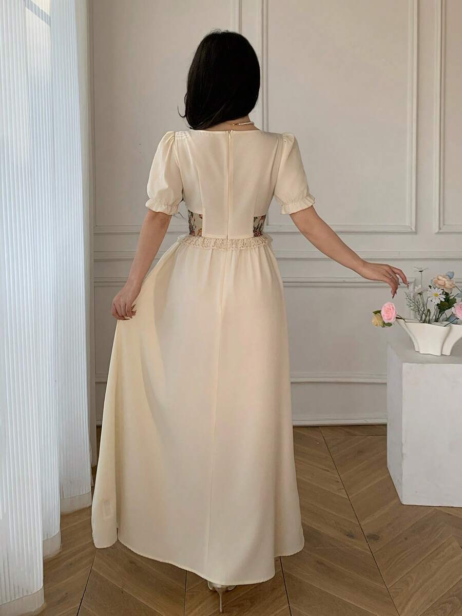 Front view of vintage floral tapestry bodice puff sleeve maxi dress showing visible color, print, and silhouette