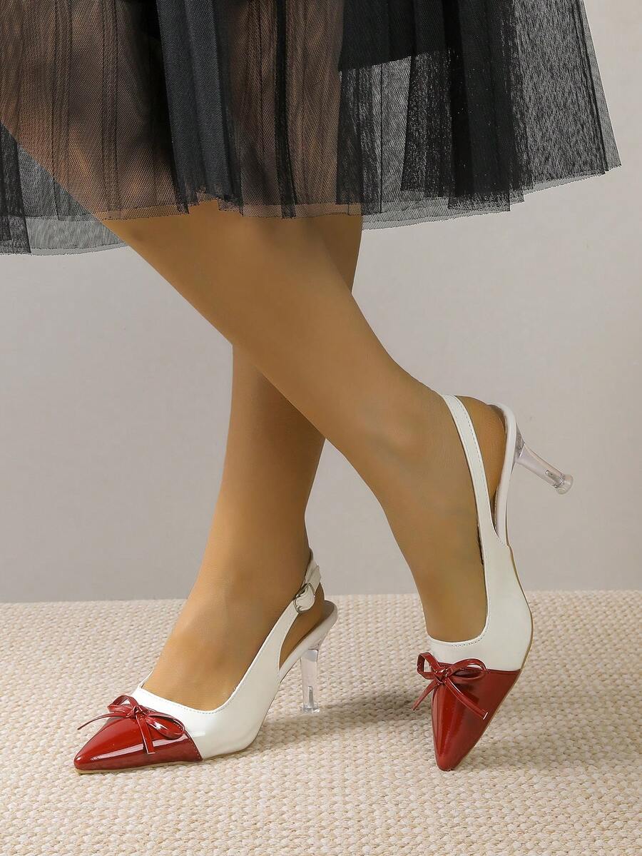 Elevate your footwear collection with these sophisticated stiletto heels, designed for the modern woman who demands both style and versatility. Featuring a sharp pointed toe and delicate bow embellishment, these heels transition seamlessly from the boardroom to evening events. The sleek silhouette elongates the leg while the elevated heel provides a confident lift to any outfit. Crafted with attention to detail, these heels deliver polished elegance whether you're making a professional impression or turning