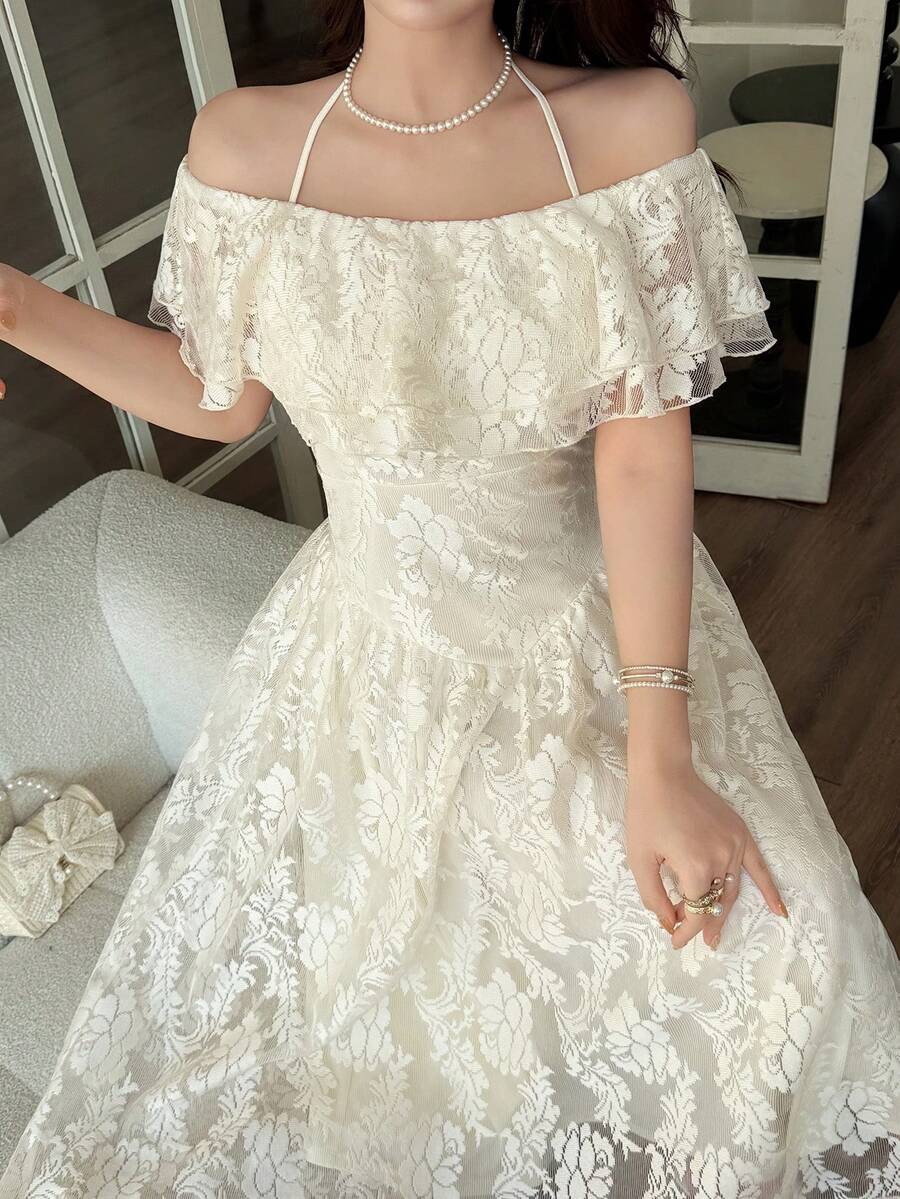 Close view of ivory floral ruffled neckline and fitted midi dress