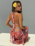 Rust floral halter maxi dress with side ruffle drape