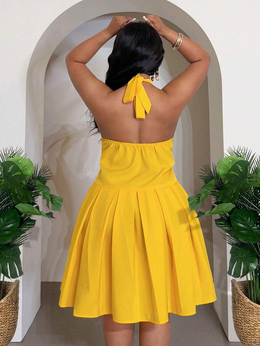 Close-up view of versatile plus-size yellow babydoll maxi dress for festivals, beach days & casual outings with maxi dress silhouette for summer casual wear