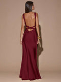 Back view of sage green with subtle sparkle sleeveless deep V-neck maxi dress with crossed open back, shown for wedding and evening wear