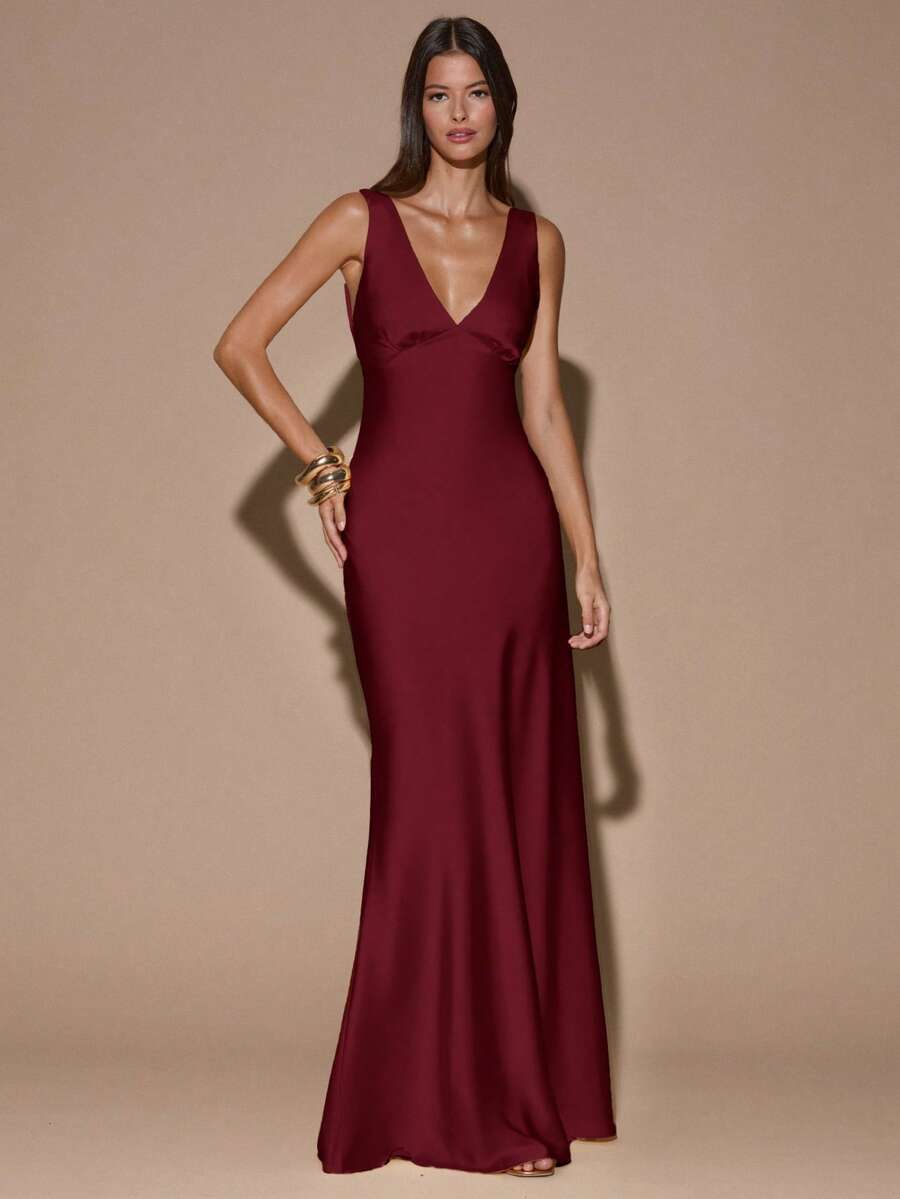 Back view of burgundy sleeveless deep V-neck maxi dress with crossed open back, shown for wedding and evening wear