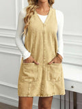 Full front view of sand khaki denim pinafore mini dress with deep V front and patch pockets