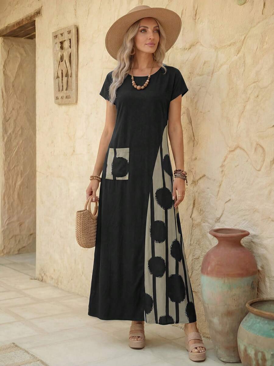 Black casual maxi dress front view with abstract side panel and straw hat