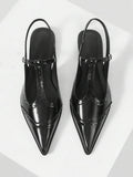 Heel view of Chic Black Patent Leather T-Strap Stiletto Sandals - Retro Hollow Design for Women for punk motorcycle boot styling