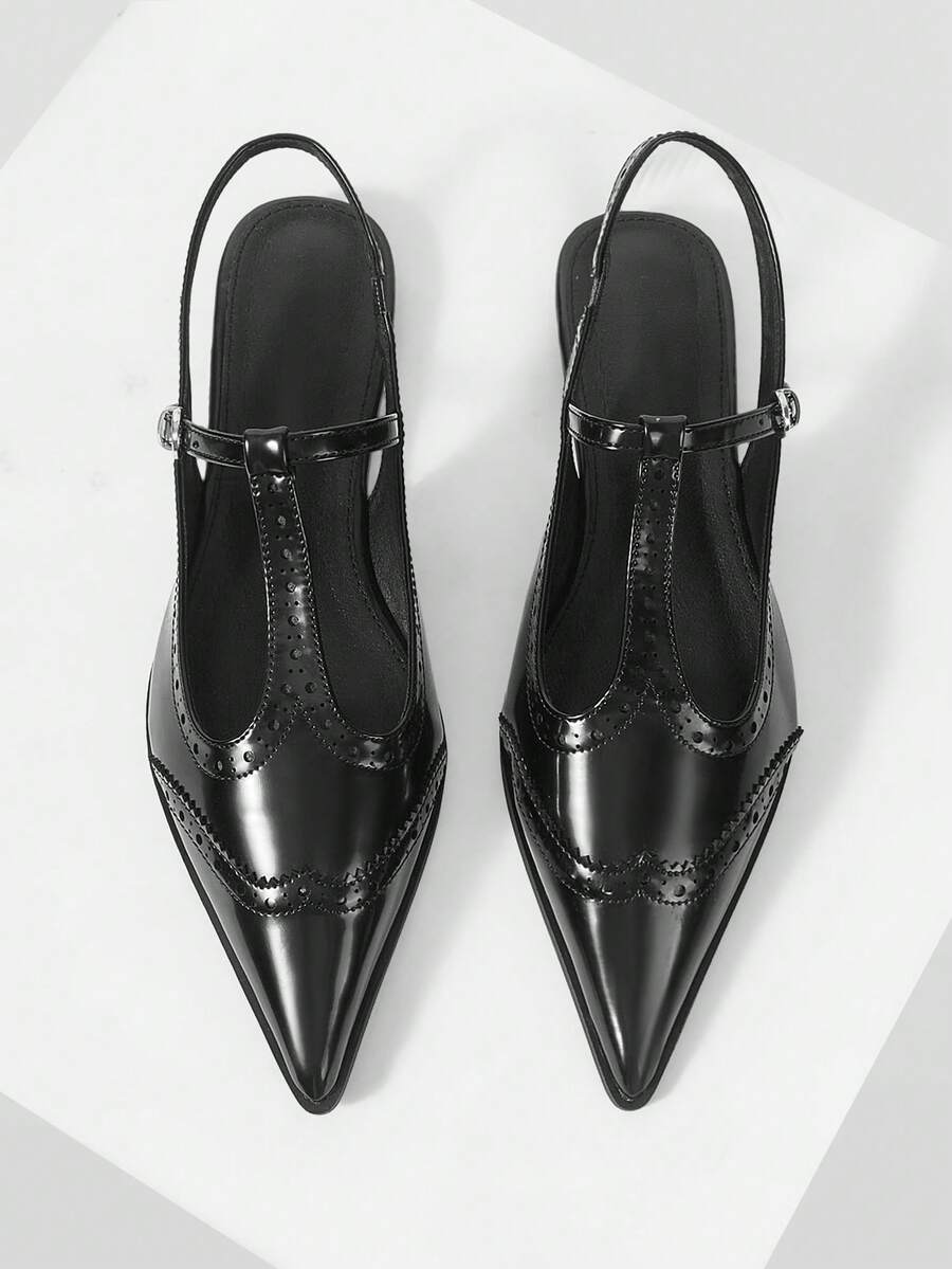 Heel view of Chic Black Patent Leather T-Strap Stiletto Sandals - Retro Hollow Design for Women for punk motorcycle boot styling