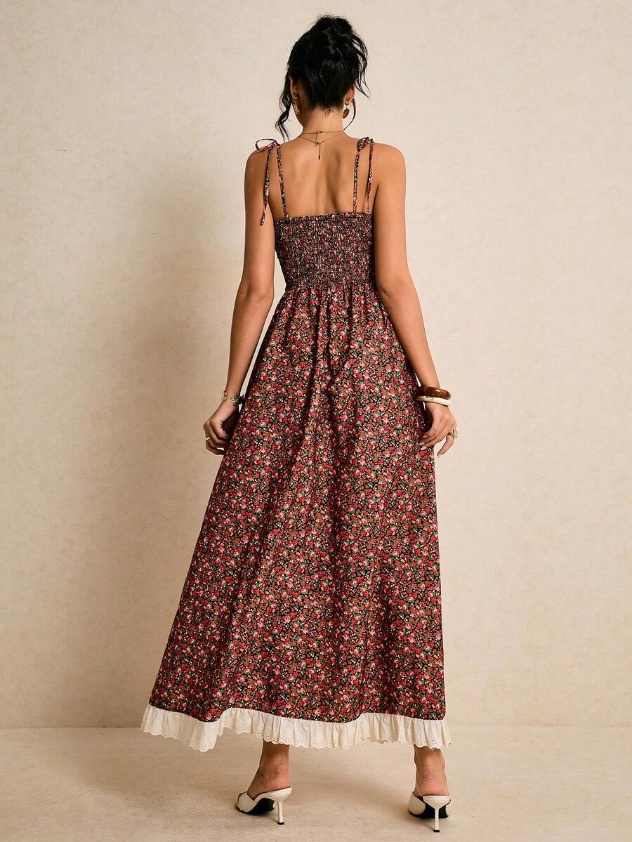 Embrace effortless elegance with this charming ditsy floral spaghetti strap dress. Featuring a high-waisted silhouette, flared maxi hem, and boho-inspired details including shirring and knotted accents, this sleeveless cami dress transitions seamlessly from vacation getaways to special occasions. The woven polyester fabric drapes beautifully while maintaining its shape. Perfect for warm-weather styling, this versatile piece celebrates timeless femininity with its delicate botanical print and relaxed yet ref