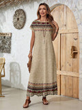 Back view of tan border print maxi dress with patterned hem and sleeves