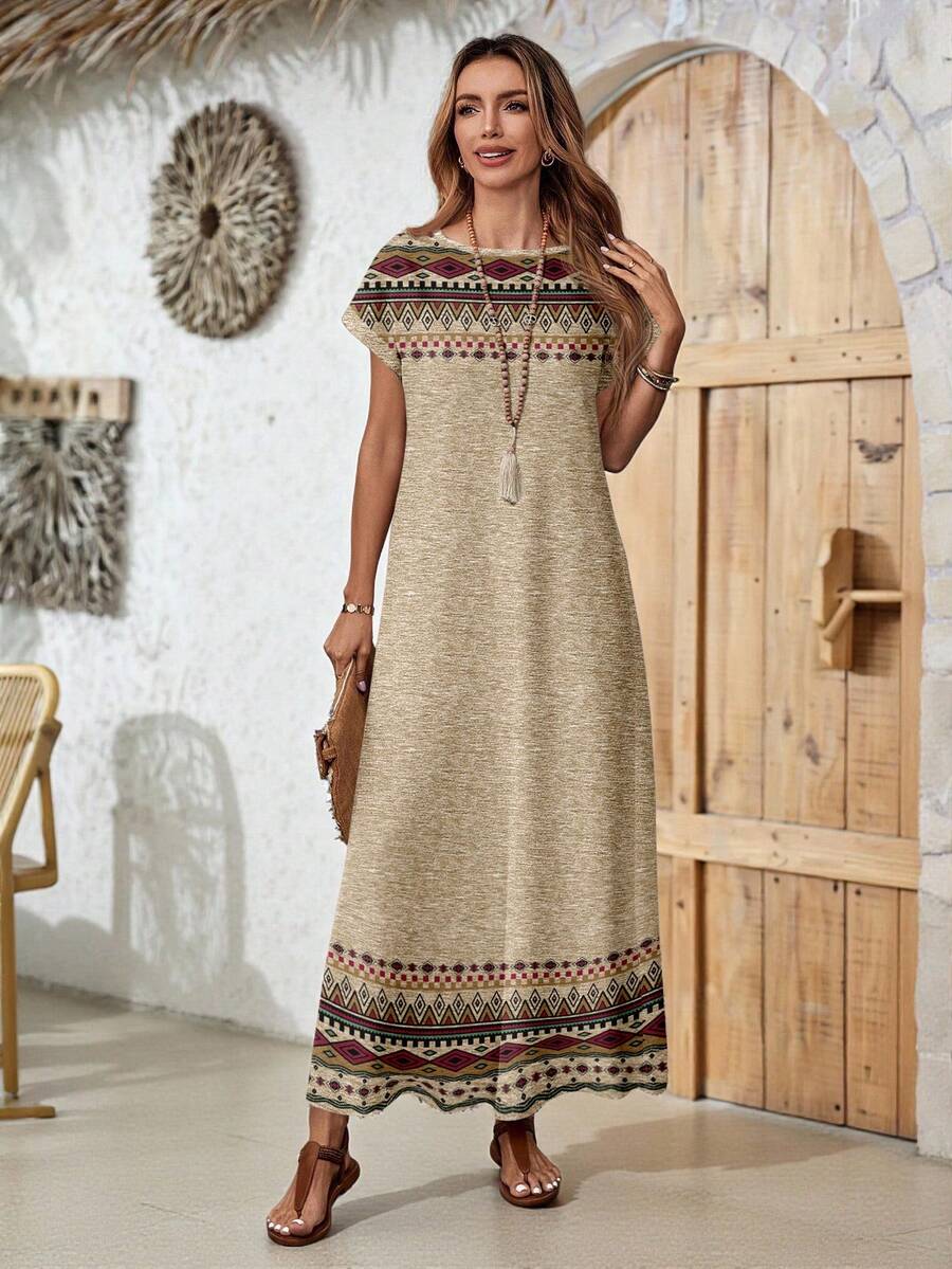 Back view of tan border print maxi dress with patterned hem and sleeves