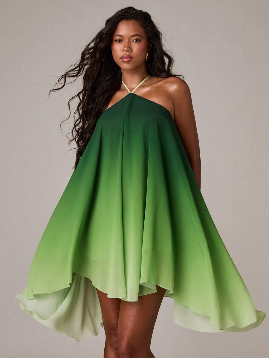 Turn heads in this stunning halter A-line dress, designed for those who love bold Y2K vibes. The backless design and asymmetrical high-low hem create an effortlessly sexy silhouette perfect for vacation getaways and casual outings. Featuring a playful ombre print in eye-catching green, this sleeveless cami-style dress offers a flattering mid-waist fit with an oversized cut for comfort. Lined throughout and crafted from 100% polyester woven fabric, it's easy to care for with simple machine washing. Whether y