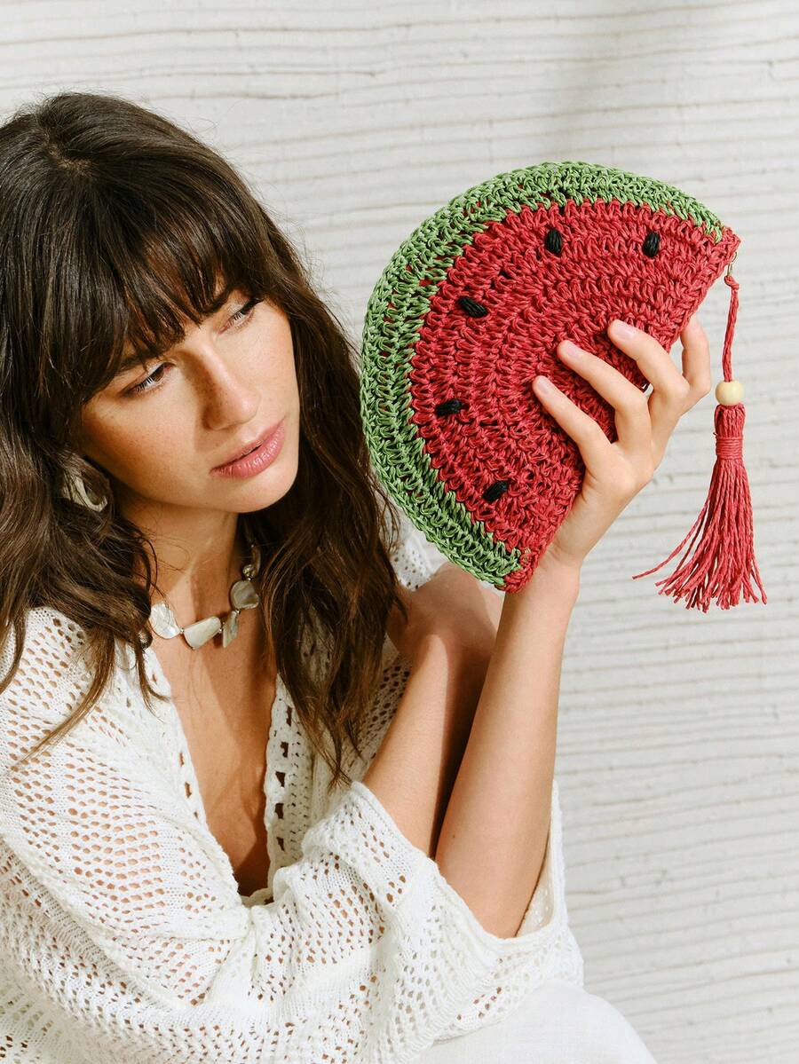 Handheld view of whimsical fruit-shaped vacation bag