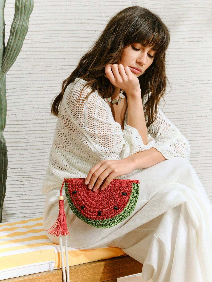 Close-up front view of fun fruit-themed clutch bag
