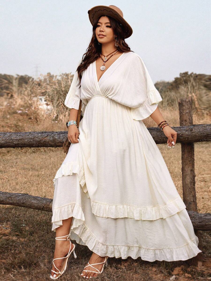 Embrace effortless elegance with this plus-size bohemian maxi dress, designed for warm-weather adventures. The tie-front detail adds a flattering, adjustable fit while the flowing silhouette moves beautifully with you. Crafted in crisp white, it transitions seamlessly from beach days to casual dinners, making it the perfect vacation essential. The relaxed bohemian style celebrates comfort without compromising on sophistication, ideal for spring and summer getaways or everyday wear that feels like a retreat.