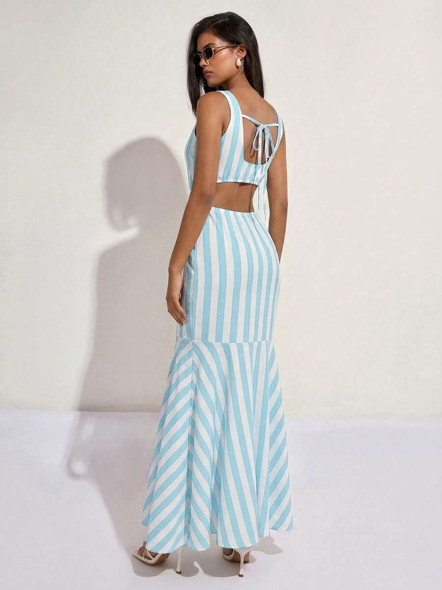 Exude Nautical Sophistication in Our Elegant Blue and White Striped Fishtail Maxi Dress!

Experience the breathtaking fusion of maritime heritage and sharp, modern artisanal tailoring. This stunning V-neck fishtail maxi dress is meticulously designed for the woman who values a high-fashion, "quiet luxury" approach to event dressing—the ultimate centerpiece for prestigious coastal weddings, exclusive vacation retreats, and high-authority special occasions.

Iconic Striped Pattern Artistry: Featuring a master