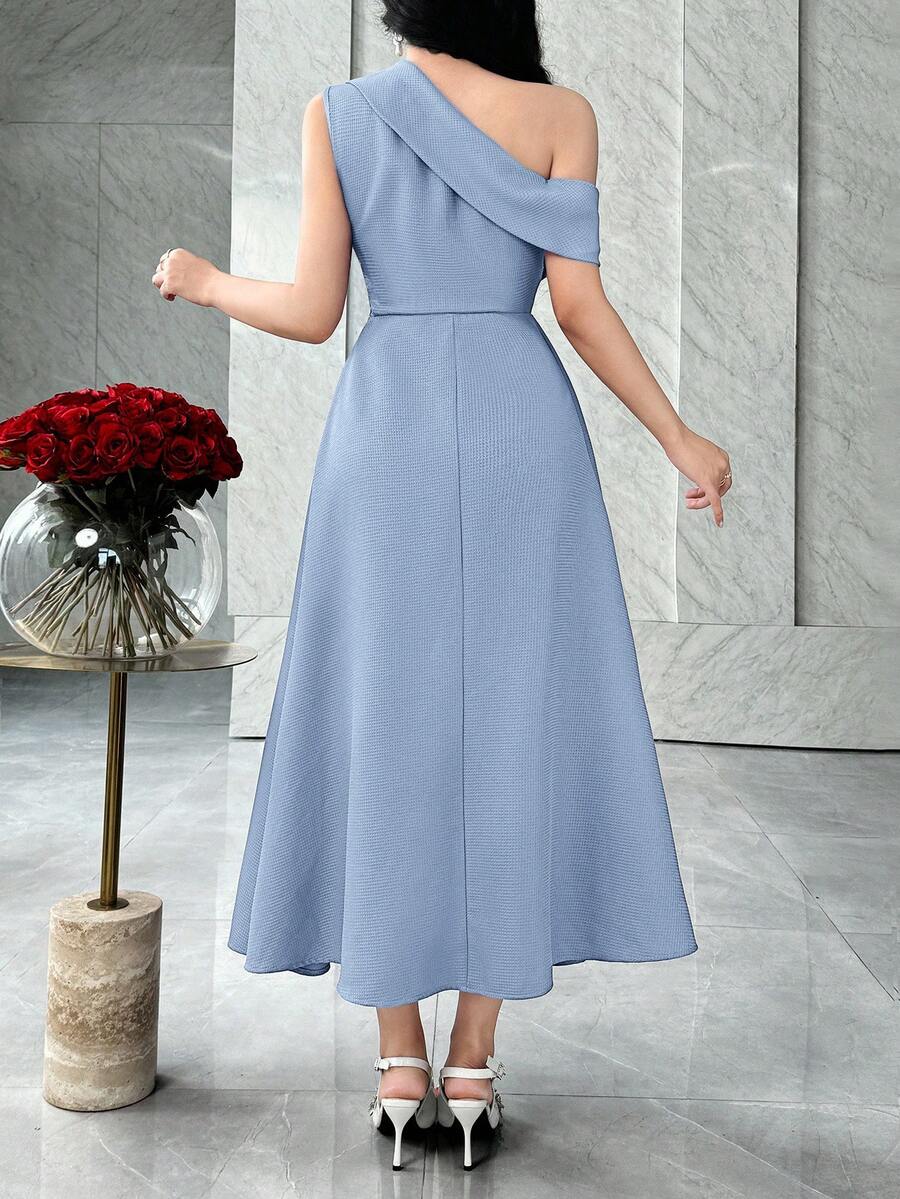 Back view of powder blue asymmetric A-line midi dress with diagonal shoulder band in marble interior