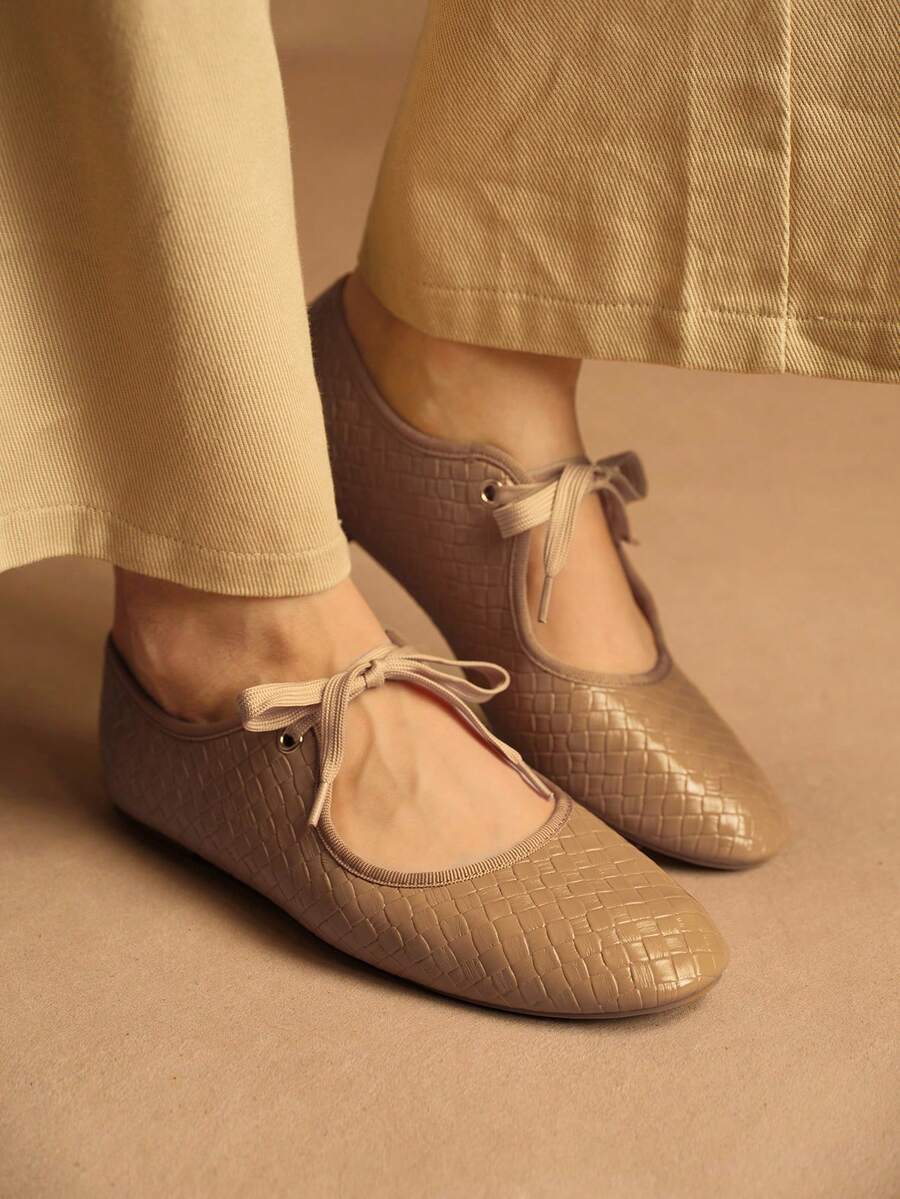 Step into effortless elegance with these versatile lace-up flat shoes designed for the modern woman. Featuring a charming bow detail and animal print pattern, they seamlessly transition from office to outdoor settings. Crafted with premium PU leather uppers and a durable TPR outsole, these Mary Jane-style flats deliver all-day comfort without compromising on style. The fabric lining and PU leather insole provide cushioning support, while the camel tone complements any casual or business casual wardrobe. Per