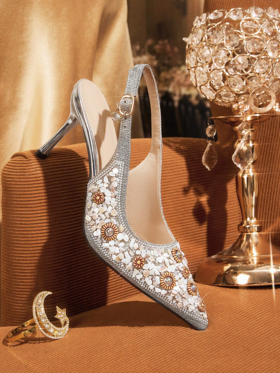 Elevate your formal wardrobe with these sophisticated rhinestone-embellished high heels. Featuring a refined pointed-toe silhouette and secure buckle strap closure, these dress shoes deliver both elegance and stability for special occasions. The sparkling rhinestone detailing catches light beautifully, making them an ideal choice for weddings, galas, and evening events. Crafted for the discerning woman who values timeless style and quality craftsmanship, these heels transition seamlessly from ceremony to ce