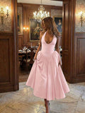 Front View of blush pink halter A-line cocktail dress with open back for wedding and party styling