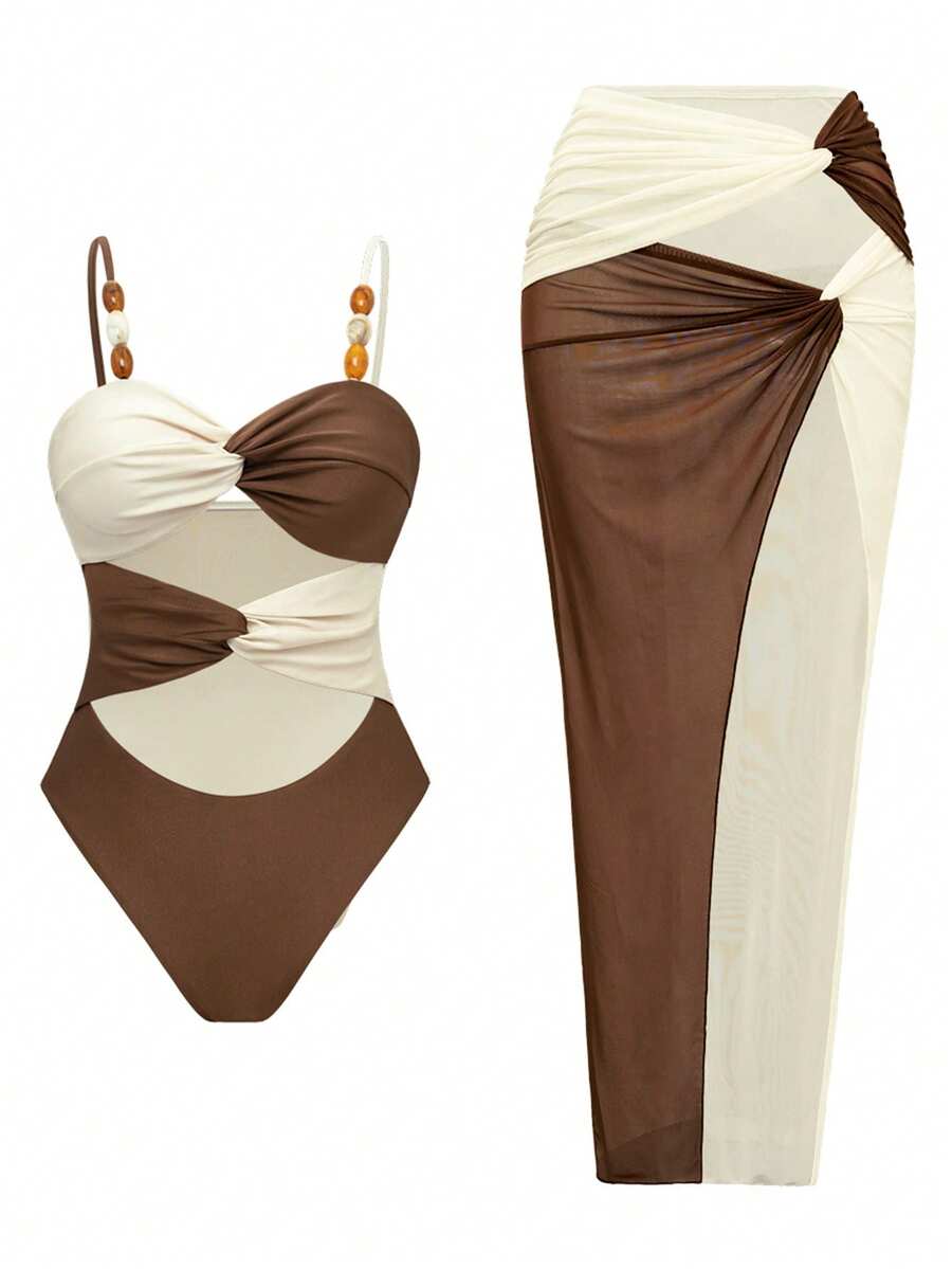 Make a splash this season with our Elegant Twist Knot Ruched Bandeau 2 Piece Swimsuit Set. Featuring a sophisticated twist knot detail at the bust and flattering ruched design, this bandeau top pairs perfectly with a coordinating high-waisted bottom and matching skirt for complete beach coverage and style. The vibrant colorblock pattern adds modern flair to your poolside look, while the included skirt offers versatile layering for beach walks or casual outings.