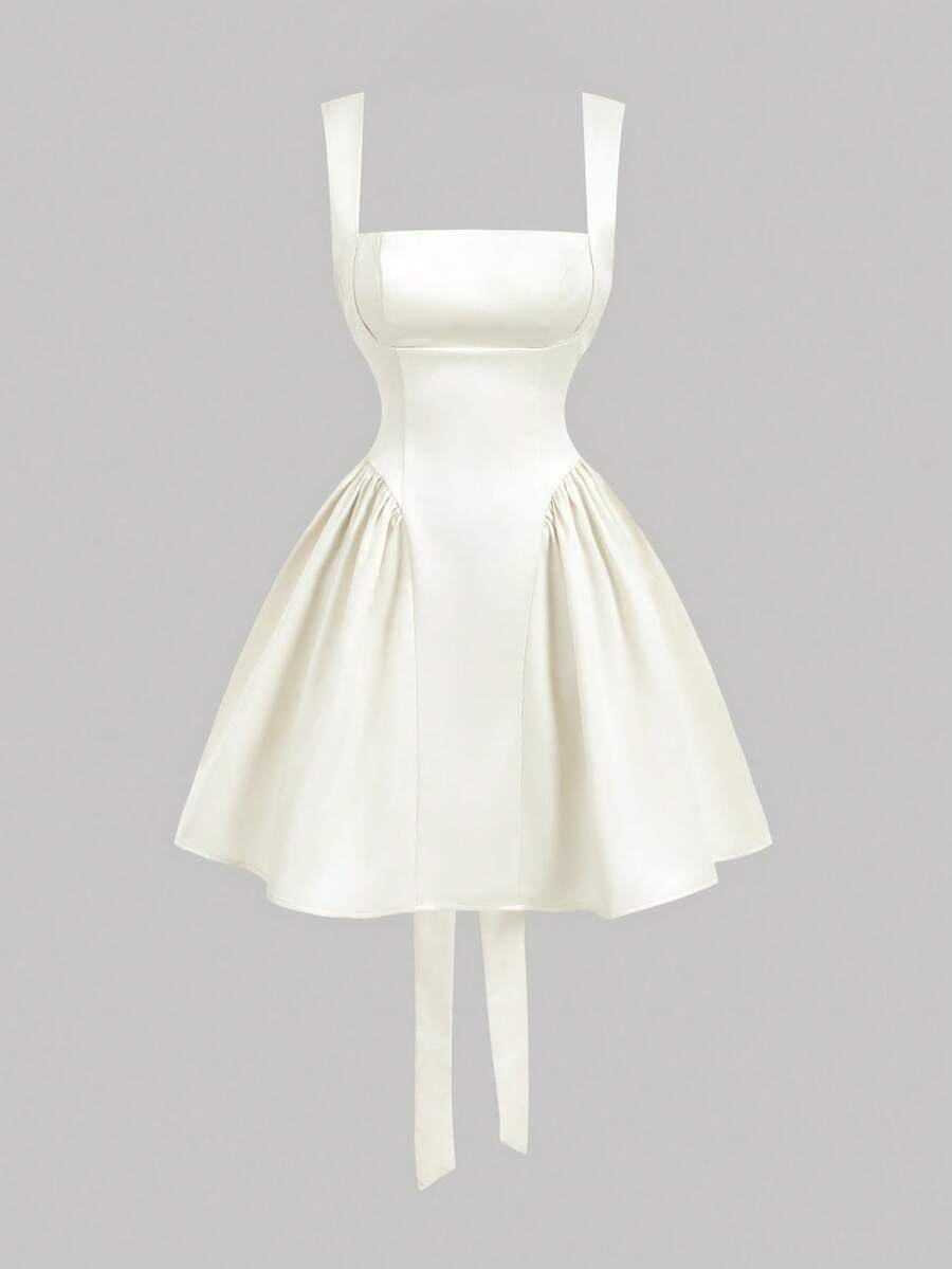 Effortless elegance meets summer style in this chic sleeveless dress. Crafted from luxurious satin, this beige beauty features a flattering regular fit with delicate straps and a stunning backless design accented by a bow detail. The shirred bodice and hidden zipper closure add refined touches, while the short length keeps things fresh and flirty. Perfect for dating, festivals, or casual outings, this versatile piece transitions seamlessly from day to night. 